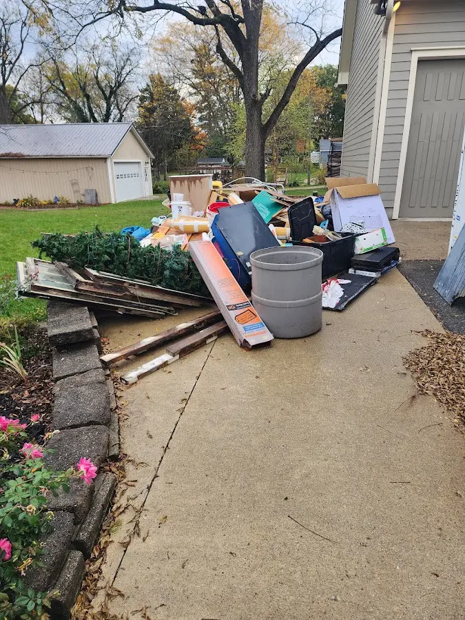 Dumpster being loaded with debris for Estate Cleanout Dumpster Rental in Hartville